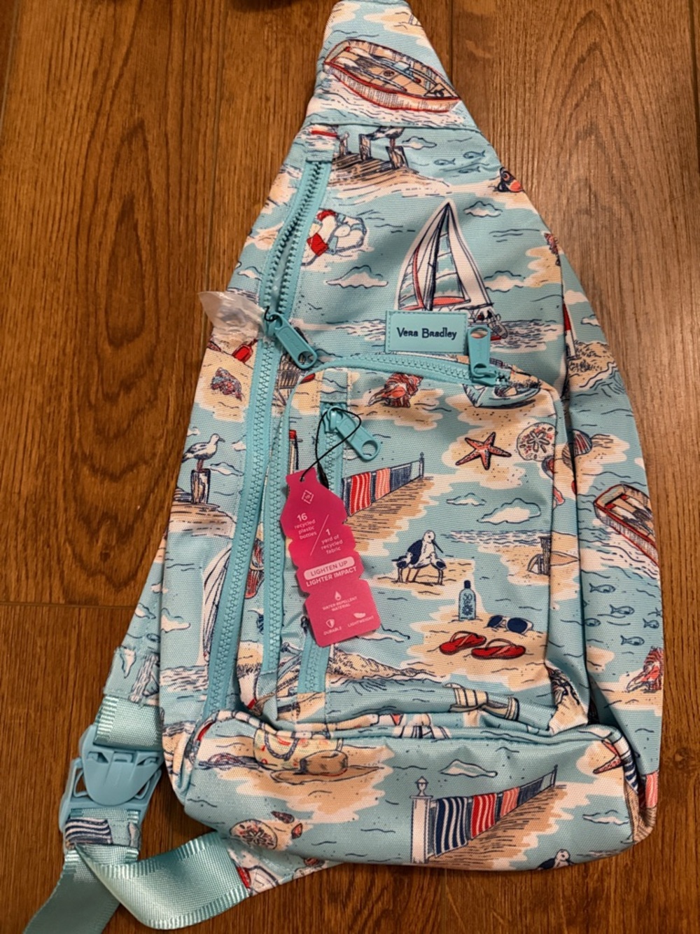 Vera Bradley coastal print sling bag in light blue with coral accents